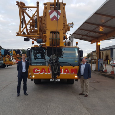 Sean Milbank and Andy Mayne stand in front of Cadman Crane