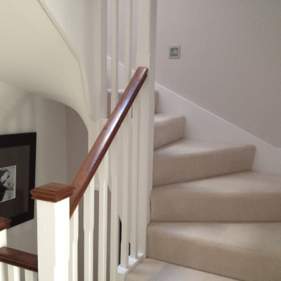 Bespoke winder staircase finished in cream carpet