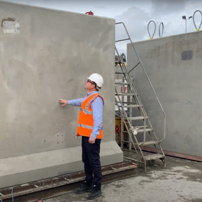 Mark Ellis stands in front of precast concrete nuclear neutron shields